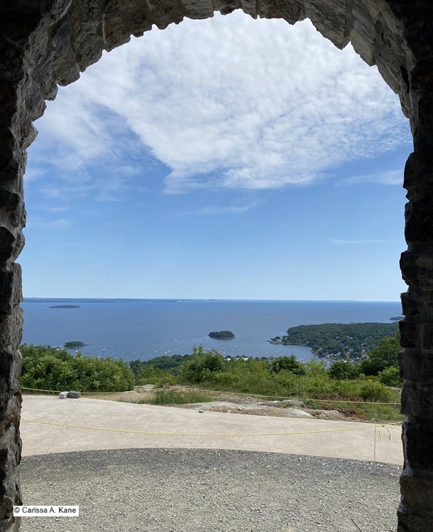 A view of the ocean from a stone arch